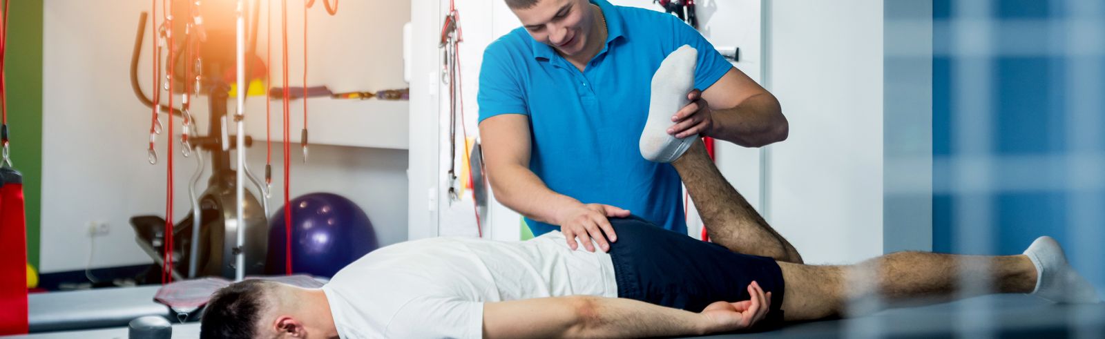 Physical therapist performing hands-on knee treatment